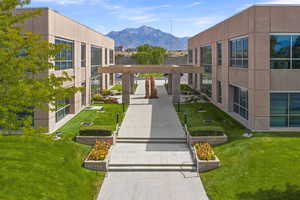 Surrounding community featuring a mountain view and a yard