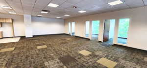 Empty room featuring a paneled ceiling