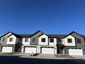 View of property with a garage