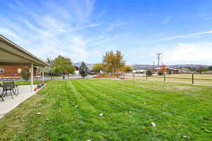 View of yard with a mountain view and a patio area