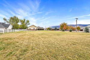 View of yard featuring a mountain view and a rural view