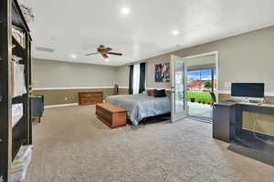 Bedroom with carpet flooring, access to outside, a textured ceiling, and ceiling fan