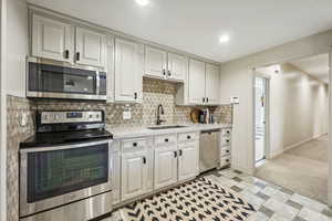 Full-size refrigerator to the left in walk in pantry