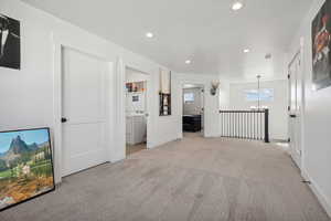 Interior space featuring a chandelier and washer / dryer