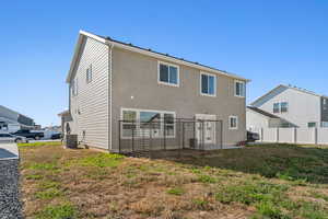 Back of property with central AC unit