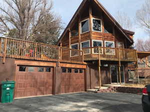 View of side of home with a garage