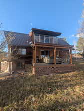 Back of property with a patio area and an outdoor hangout area