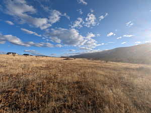 Property view of mountains featuring a rural view