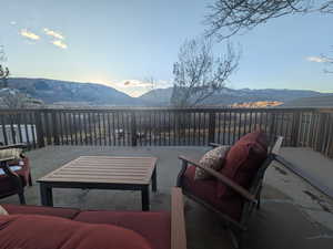 View of patio with a mountain view and an outdoor living space