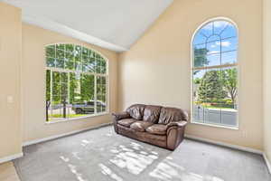 Entry living room with lofted ceiling