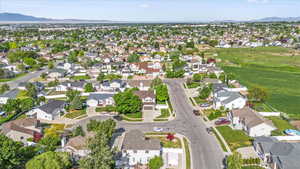 Aerial view of property and surrounding area and nearby suburban area