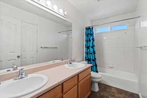 Full bathroom featuring vanity, and shower / tub combo