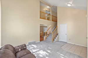 Entry living room with lofted ceiling