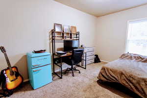 Bedroom with light colored carpet