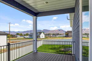 Wooden terrace with a lawn and a mountain view