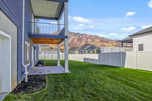 View of yard featuring a mountain view and a patio