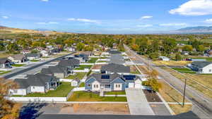 Birds eye view of property with a mountain view