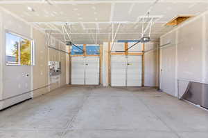 Garage featuring a garage door opener