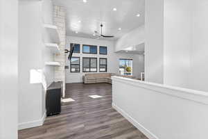 Corridor featuring hardwood / wood-style flooring