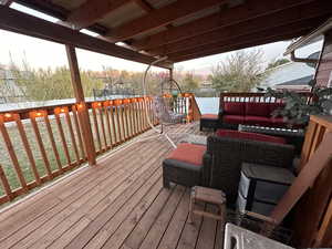 Wooden terrace featuring outdoor lounge area