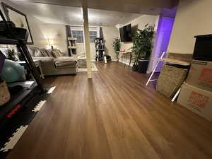 Workout room featuring a textured ceiling and hardwood / wood-style flooring