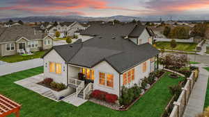 Exterior space with a yard and a mountain view