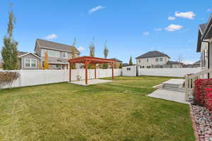 View of yard with a patio area and a pergola