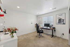 Office with light colored carpet