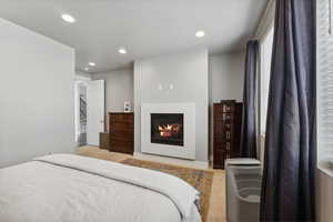 Bedroom featuring light colored carpet