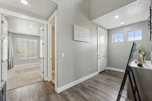 Foyer entrance with hardwood / wood-style flooring