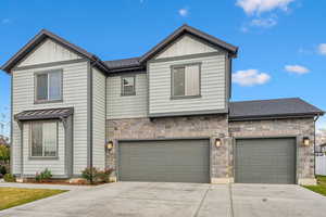 View of front of home with a garage