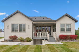 View of front of property featuring a front lawn