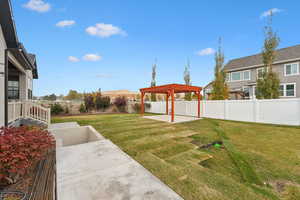 View of yard featuring a patio area and a pergola