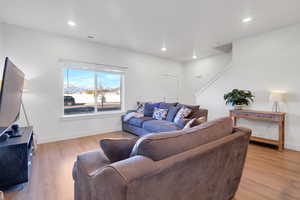 Living room with light wood-type flooring