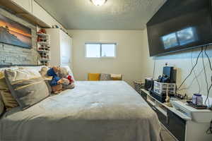 Bedroom featuring a textured ceiling