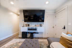 Living room with wood-type flooring