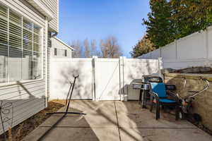 View of patio featuring a grill