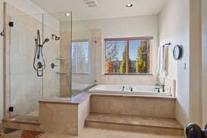 Primary Bathroom  walk in shower and tile.