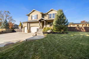 View of front facade with a garage and a front yard