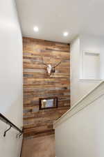 Stairs with wooden accent walls