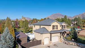 View of front of house featuring a mountain view and a garage