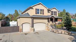 View of front of home featuring a garage and a mountain view