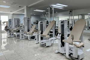 Gym featuring light tile patterned floors