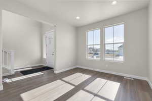 Foyer entrance featuring dark hardwood / wood-style flooring