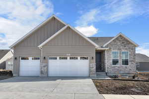 Craftsman-style house featuring a garage