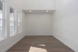 Unfurnished room with dark hardwood / wood-style floors