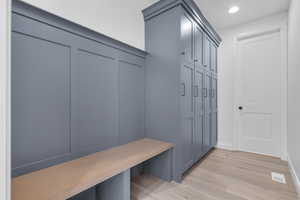 Mudroom with light wood-type flooring