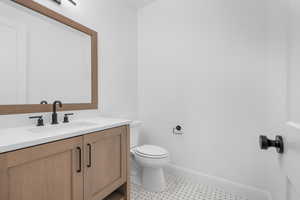 Bathroom with vanity and toilet