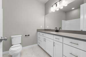 Bathroom with toilet and vanity