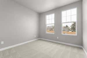 View of carpeted spare room